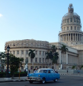 A typical Cuban car navigates the traffic circle around the Capital (under construction in Feb. 2016)